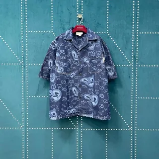 Short-sleeve denim shirt with an all-over paisley print