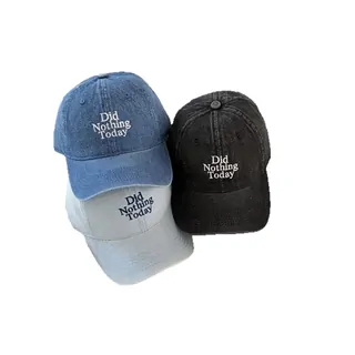 Washed denim cap with a small embroidered phrase